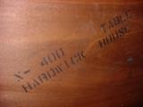 Mark on bottom of mahaogany dining room table.