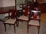 All six chairs are very solid. One is a captains chair.