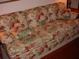 Sofa with Floral pattern fabric.