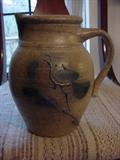 Beautiful bird design on hand made Rowe Pottery pitcher.