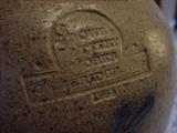 Rowe Pottery mark close up.