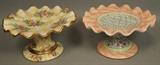 Lot 4:  2pc MACKENZIE CHILDS Ceramic Pedestal Cake Stand. Fluted Stands. Hand painted. "Bearded Iris" & "Lemon Curd" patterns. Each candlestick retails for $400. : Dimensions:  H: 6.5 inches: W: 12 inches: D: 12 inches --- US Shipping charge: $35