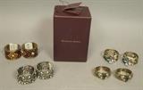 Lot 17:  Lot 8 MICHAEL HERO Napkin Rings. Swarovski crystals. Four pair of napkin rings with enamel and crystal details. In Michael Hero box. Largest napkin ring is 1 1/8" wide: Dimensions:   --- US Shipping charge: $20
