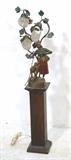 Lot 38:  Figural Antique Lamp with glass beaded shades. Woman with sheep and rake. Three bud form glass bead shades. Mounted on wood pedestal base.: Dimensions:  H: 45 inches: W: 11.5 inches: D: 7 inches --- 