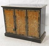 Lot 40:  DREXEL Ebonized Asian style Two Door Cabinet. One bi-fold door. Fitted interior. Raised oriental design to doors. Two part flip top. On casters. Back is finished. Marked. : Dimensions:  H: 33 inches: W: 39.25 inches: D: 19 inches --- 