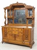 Lot 42:  Large Antique Victorian Carved Oak Sideboard. Fancy carved trim & details. Mirror back. Doors carved with floral elements. : Dimensions:  H: 88 inches: W: 66 inches: D: 28 inches --- 