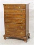Lot 51:  Traditional 7 Drawer Tall Dresser. Brass pulls. Bracket feet. Not marked. : Dimensions:  H: 54 inches: W: 36 inches: D: 19.5 inches --- 