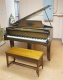 Lot 53:  GEORGE STECK Baby Grand Piano & Bench. Mahogany. Aeolian Crafts metal tag. Model VA123591. Piano has some decorative punched details with darker stain.  : Dimensions:  H: 38.5 inches: W: 55 inches: D: 54 inches --- 