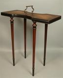 Lot 65:  WEIMAN Heirloom Small Side Table. Leather top. Metal strap handle. Thin tapered legs with ebonized feet. : Dimensions:  H: 21.5 inches: W: 19.5 inches: D: 8.5 inches --- 