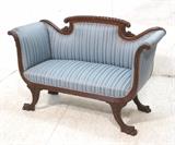Lot 86:  Blue Upholstered Empire Settee Couch. Carved details with paw feet. : Dimensions:  H: 36 inches: W: 56 inches: D: 21 inches --- 