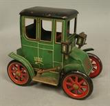 Lot 106:  Small Painted Tin Litho Green Car. Trademark Modern Toys. Japan #104210. : Dimensions:  H: 5 inches: W: 5.5 inches: D: 3.25 inches --- US Shipping charge: $20