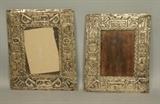 Lot 159:  Two Mexican Silver Picture Frames. Plata Zetko. Embossed design of masks & faces. Marked. : Dimensions:  H: 10.75 inches: W: 9.25 inches --- US Shipping charge: $20