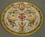 Lot 169:  Signed Faience Plate. Italian Pottery Ceramic. Dolphins & winged women. : Dimensions:  H: 11 inches: W: 11 inches --- US Shipping charge: $35