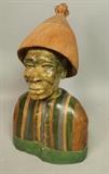 Lot 173:  PAULUS KGAILE Carved African Bust Sculpture. Carved Stone, Wood, Ivry Bust of Man with Cone Shaped Wood Hat. Signed P. KGAILE.: Dimensions:  H: 11 inches: W: 7 inches: D: 7 inches --- 