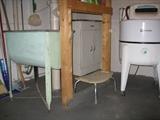 Metal cabinet in back and Maytag washer