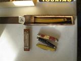 Long razor in wood box, knives, harmonica 