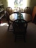 Dining room table and 4 chairs plus 2 leafs.