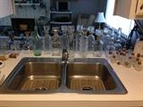 "Everything but the kitchen sink" Note the glass bottles are for sale!
