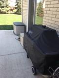 Weber gas grill and Rubbermaid deck box.