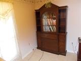 VINTAGE Book Case/Curio Cabinet - 1 glass door with wooden backing on glass - 3 display shelves on either side (on top) - 4 drawers in middle (on bottom) - 1 small drawer (on either side); 2 doors on either side opens to 2 shelves on either side - no key - 52" wide; 82" tall; 12" deep - NICE!!!! 