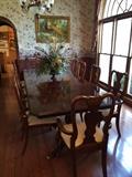  American  Drew dining table w/ 10 upholstered chairs. Table has two leafs and a custom pad.  Table is 43" wide.... 120"" long 2 leafs 24" each