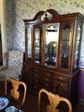 America Drew China cabinet with lighted cabinet, glass shelves and beveled glass doors.  Cabinet is 60"wide and 81 "tall a lot of storage and display!