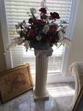 Display pedestal  with floral arrangement.
