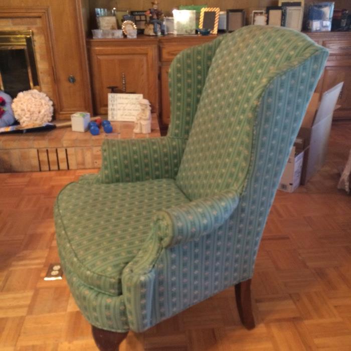 Pair of teal fabric wing backs with matching ottaman 