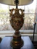 Family Room/Breezeway:  One of a pair of Capo di Monte cherub lamps.  