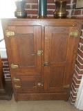 Family Room/Breezeway: An antique oak ice box with three doors measures 46" tall x 31" wide x 17-l/2" deep.