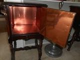 Living Room:  One of the smoking stand table door's is open to reveal the copper lining.