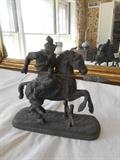 Living Room:  This spelter figure depicts a warrior  and his horse in battle.  It is 8" tall with an 8" plinth and is sold "as is"--slight crack.