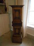 Living Room:  A square wooden pedestal measures 37-l/2" tall. 