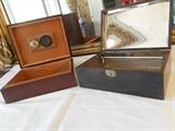 Living Room:  Two vintage humidor/cigar chests.  The one on the left is wood lined and has a gauge in its lid; the one on the right is tin lined.