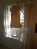Bedroom #3:  We hung vintage Christening gowns and baby slips.  Women's vintage silky slips are also hung in Bedroom #2-bathroom. 