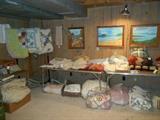 Lower Level:  Quilts, spreads, sheet sets, comforters, artwork.