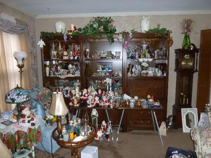 Thomasville 3 piece shelving unit(bookcase), grandmother clock, collectible Santa, Tiffany Lamp