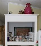 The pink vase and colored bamboo tray are sold.