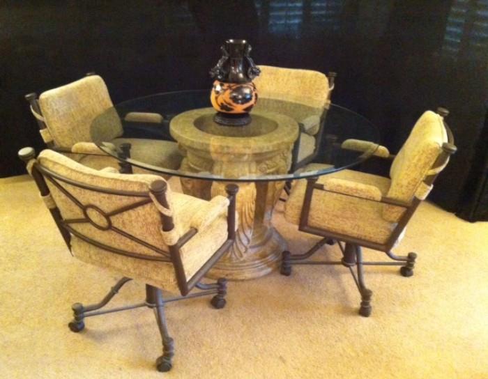 Glass-top dinette with 4 rolling chairs