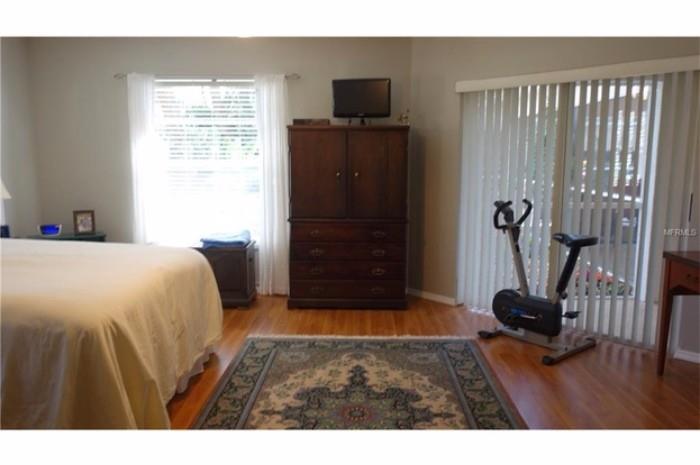 Master bedroom rug, armoire, exercise bike...mattress & boxspring not for sale.