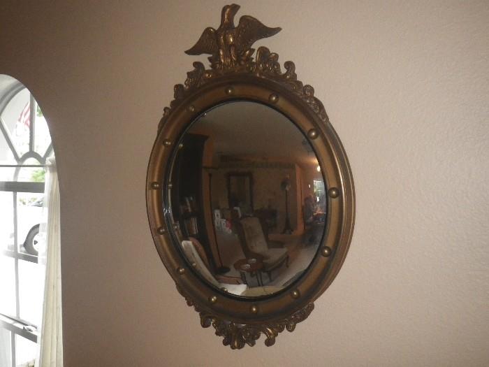 Girandole (mercury glass) convex mirror with wood frame and eagle top.