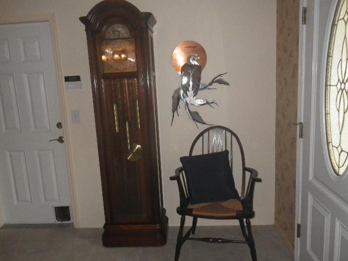 Howard Miller grandfather clock, Empire chair, signed metal eagle sculpture.