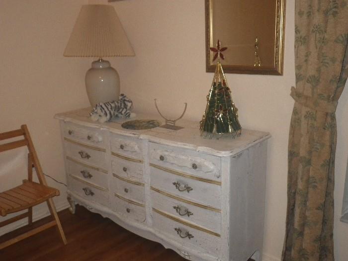 Distressed dresser, ginger jar lamp, wood folding chair