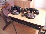 Two old Western Electric for Bell System phones. Old school desk.