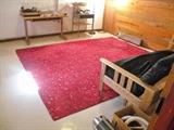 Futon. Room size theater carpet.