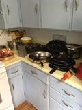Kitchen full of pans, dishes, classes, etc.