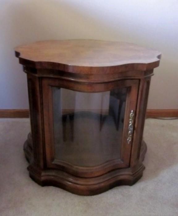 Wood display end table with door and shaped glass panels, also has interior light ... nice.
