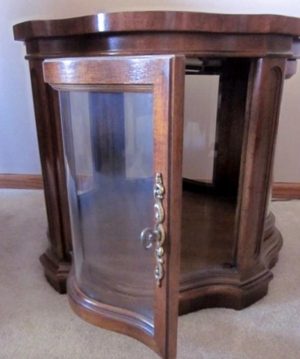 Wood display end table with door and shaped glass panels, also has interior light ... nice.