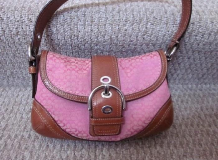 Cute COACH Pink logo purse with leather buckle and trim.