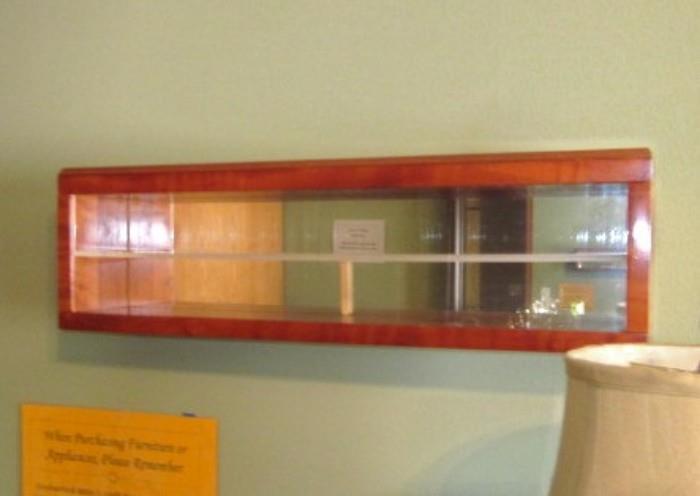 Wood display case with one shelf and mirrored back (24" wide x 7" tall).